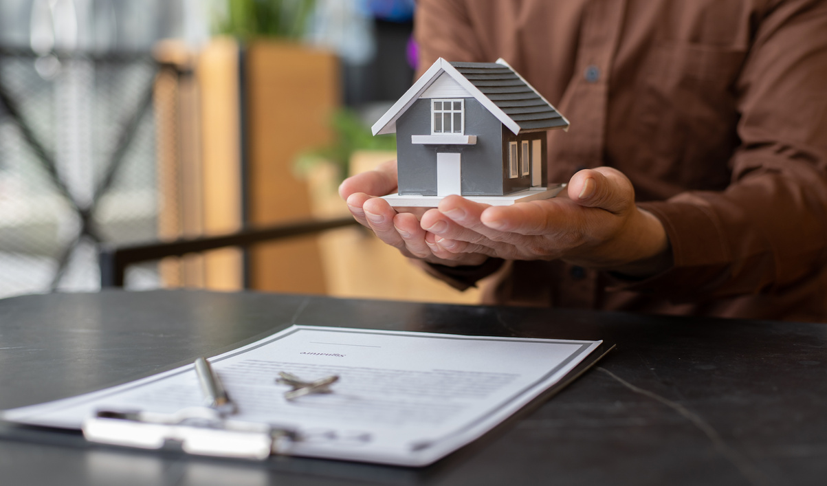 Man Contract Signing for New Home 